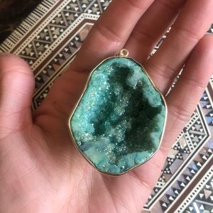 Geode pendant. Includes a long goldtone chain.